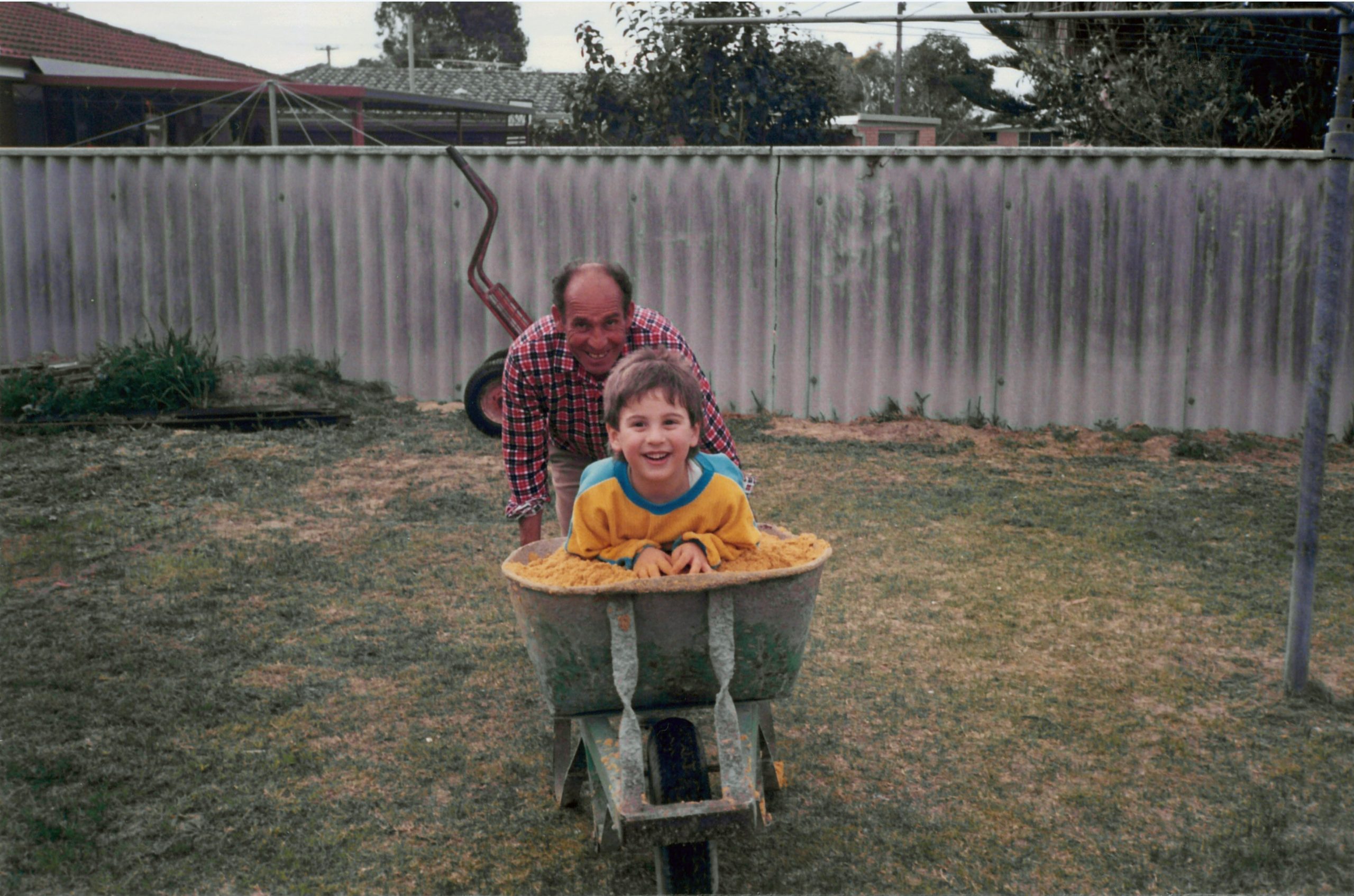 Anthony in wheelbarrow